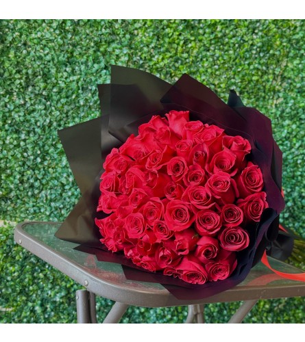 50 Red Rose Bouquet. An arrangement by Flower World and Gifts.