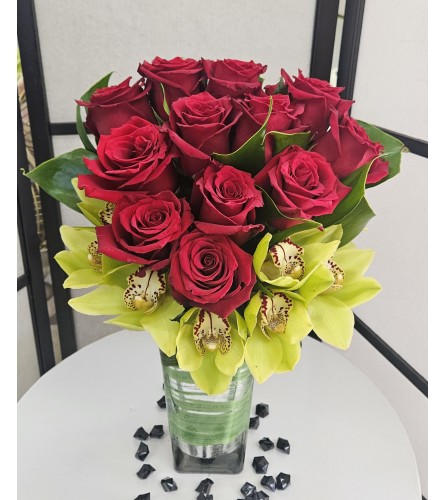 Exotic Orchid Roses - Deluxe. An arrangement by Brickell Exclusive Blooms.