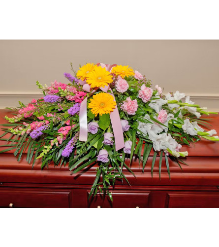 Casket Spray Colour of Spring. An arrangement by Flowers and Beyond.