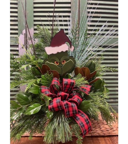Grinch Outdoor Winter Greenery Arrangement. An arrangement by Forest Florist.
