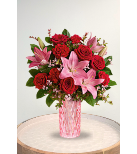 Romanced By Roses - Deluxe. An arrangement by Blossoms On The Trail.