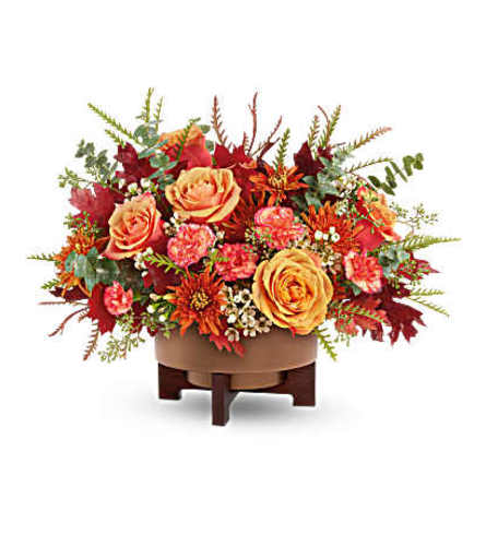 Teleflora's Modern Copper Centerpiece - Deluxe. An arrangement by Michael's Flowers.