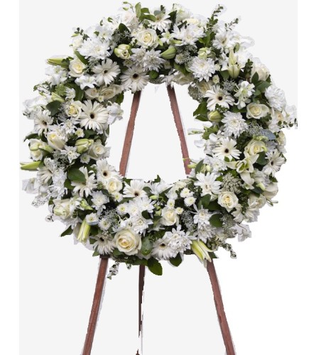 Pure Grace Wreath - Deluxe. An arrangement by Geni's Florist and Gifts.