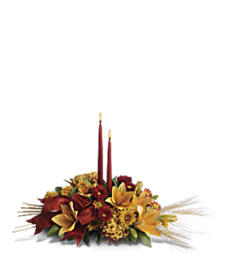 Graceful Glow Centerpiece. An arrangement by Tallevast Florist.