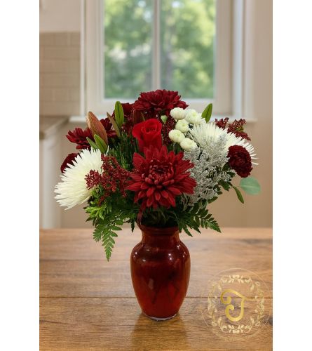 Crimson and Snow Holiday Vase. An arrangement by Lori's Hearts and Flowers.