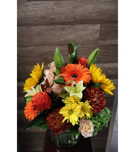 Bright Harvest Blooms. An arrangement by Sonia's Florist.
