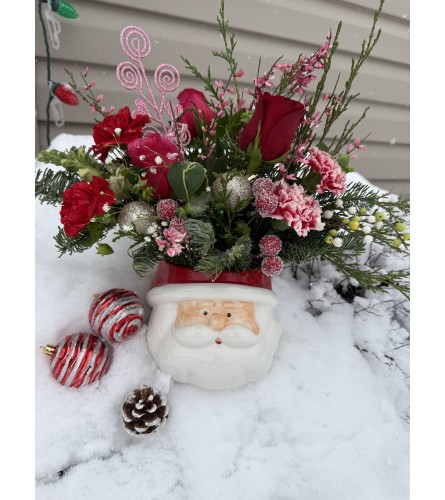 Best Seller Pink Santa. An arrangement by Kelly Ann's Floral.