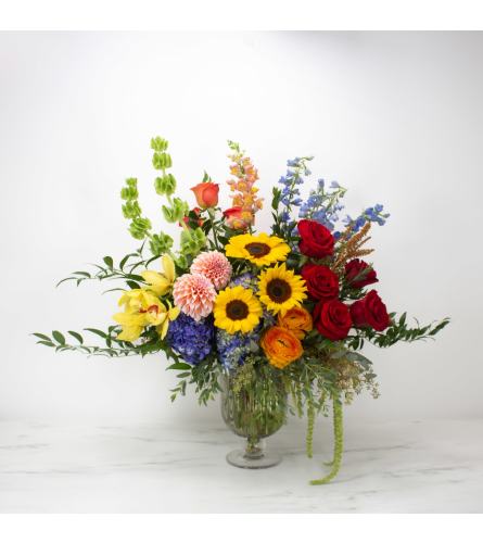0VER THE RAINBOW LUXURY BOUQUET. An arrangement by Aventura Blooming Petals.