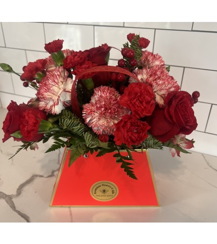 Christmas Tote Bouquet. An arrangement by Brookdale Flowers and Gifts.