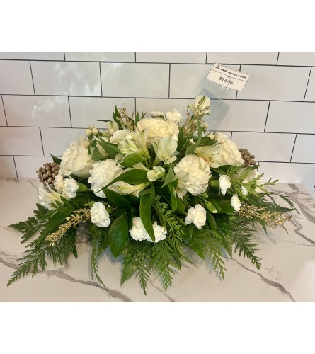 Snowy White Christmas Centerpiece. An arrangement by Brookdale Flowers and Gifts.