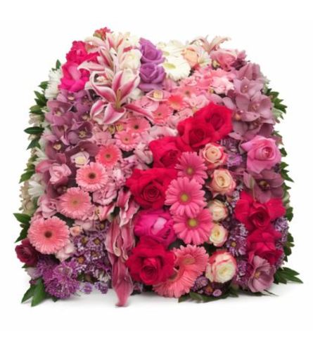 Blanket of Blossoms. An arrangement by Simply Beautiful Flowers and Events.