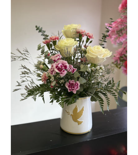 Heavens wings sympathy arrangement. An arrangement by Kelly Ann's Floral.