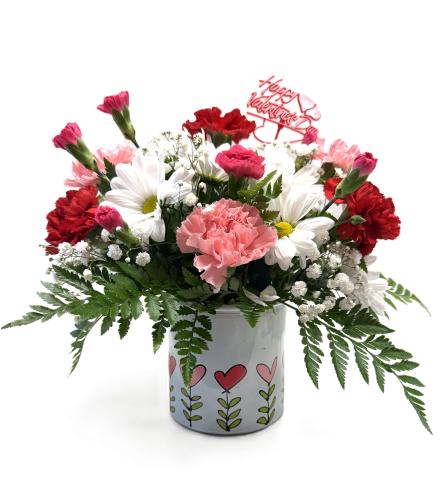 Hugs. An arrangement by Brown Floral and Fudge.