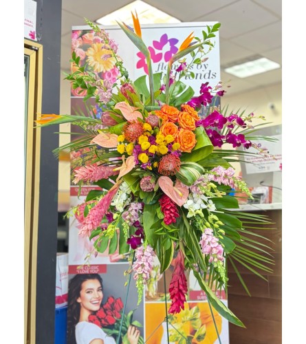 Tropical Radiance Spray - Deluxe. An arrangement by Flowers by Girlfriends.