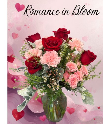Romance in Bloom. An arrangement by Flower Barn.