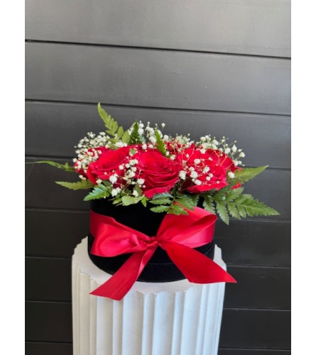 Dozen Roses In Velvet Hat Box. An arrangement by Marianna's Flower Island.