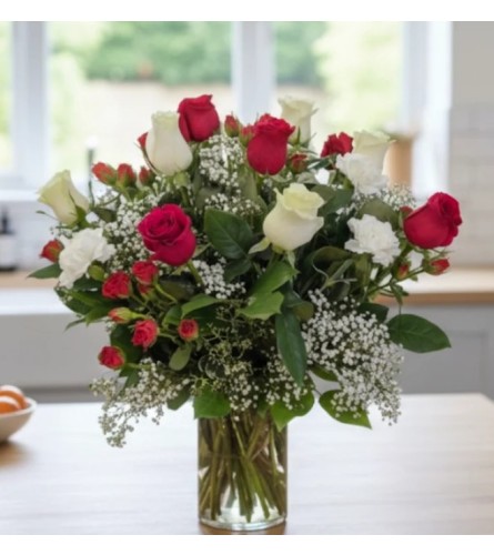 Romance in Bloom. An arrangement by Sophie's Flowers.