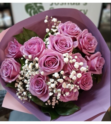 Dozen Lavender Rose Bouquet. An arrangement by Sophie's Flowers.