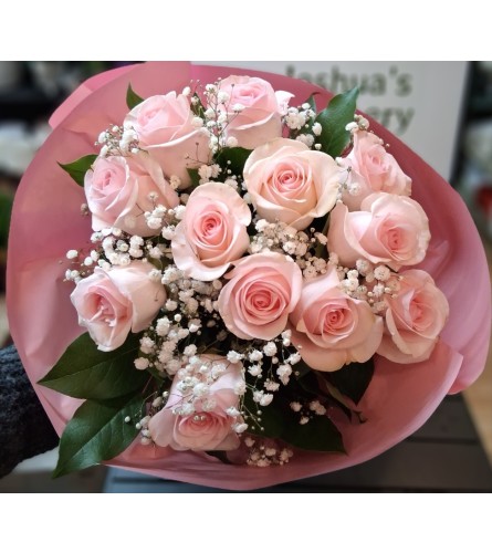 Dozen Lite Pink Rose Bouquet. An arrangement by Sophie's Flowers.
