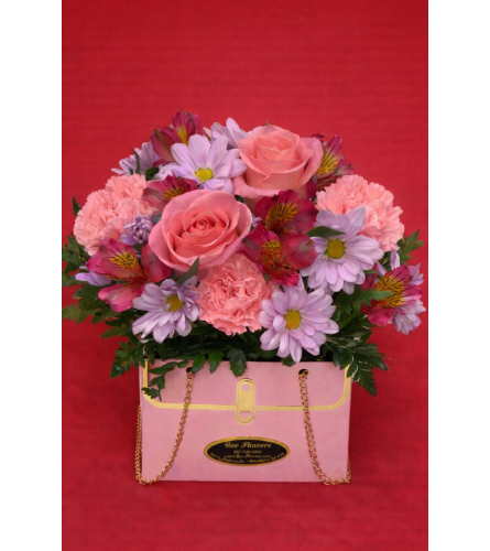 Purse of Love. An arrangement by Bee Flowers.