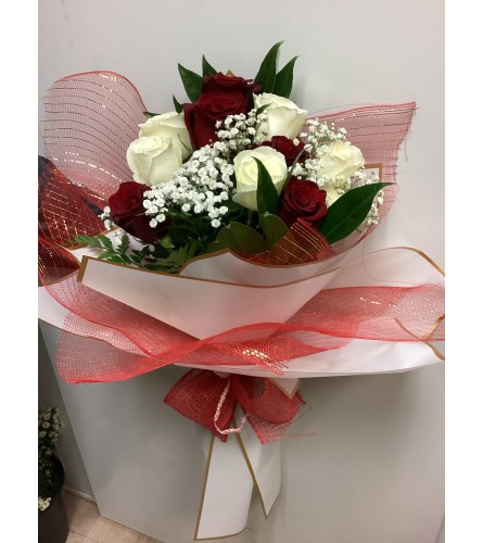 Fancy Rose Bouquet. An arrangement by Roma Flowers and Gifts.