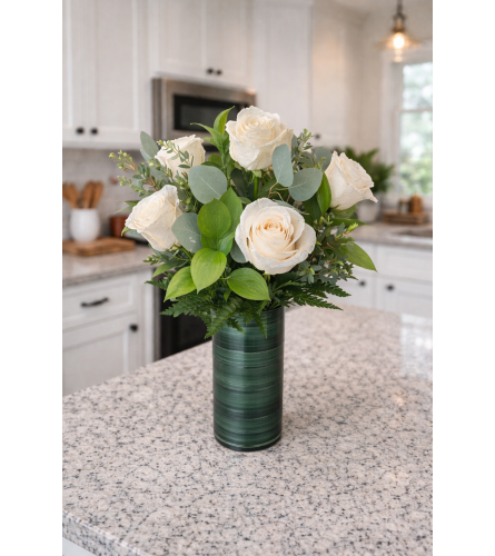 DELUXE WHITE ROSES - Standard. An arrangement by Petals and Co..