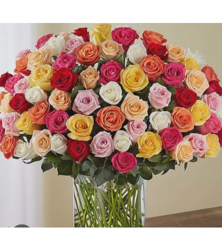 100 ASSORTED ROSE BOUQUET IN VASE. An arrangement by KW Flowers.