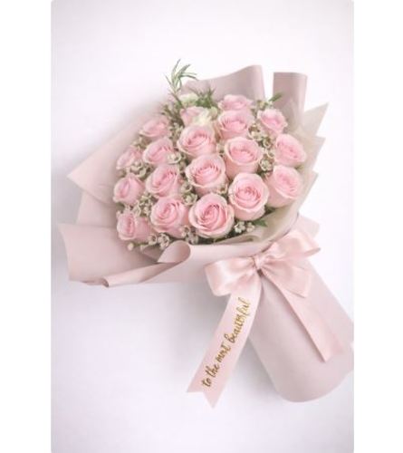 Pink Roses wrap Bouquet - Deluxe. An arrangement by Geni's Florist and Gifts.
