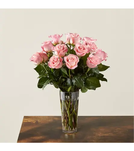 Long Stem Pink Roses - Deluxe. An arrangement by North Liberty Flower Shop.