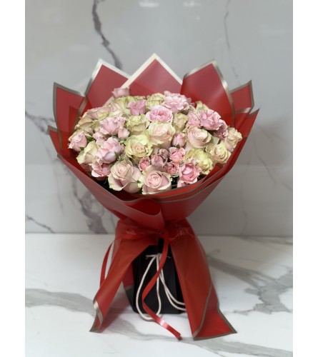 Two Dozen Premium Light Pink Roses. An arrangement by Grower's Flower Market and Gifts.