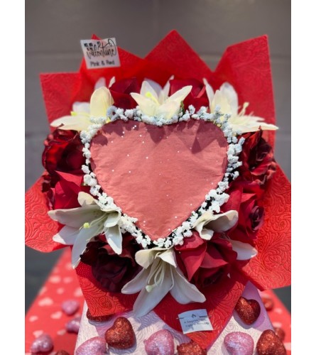 Burn Reveal Bouquet6. An arrangement by Bertha's Florist.