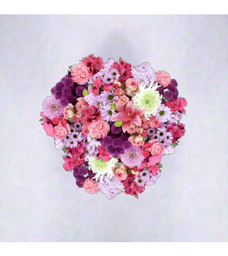 Pumping Heart Wrapped Bouquet - Deluxe. An arrangement by Thompson's Full Bloom.