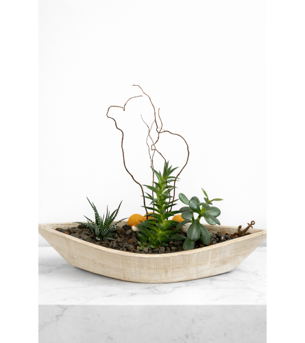 Wooden Boat Planter. An arrangement by Lori's Hearts and Flowers.