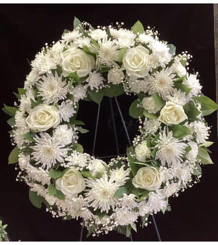 Resting Peacefully. An arrangement by Roma Flowers and Gifts.