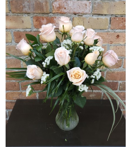 'By Design' Peach Rose Arrangement. An arrangement by Flowers By Design.
