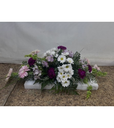 Long Low Easter Centerpiece. An arrangement by Gonsalves-Fasso Flowers.