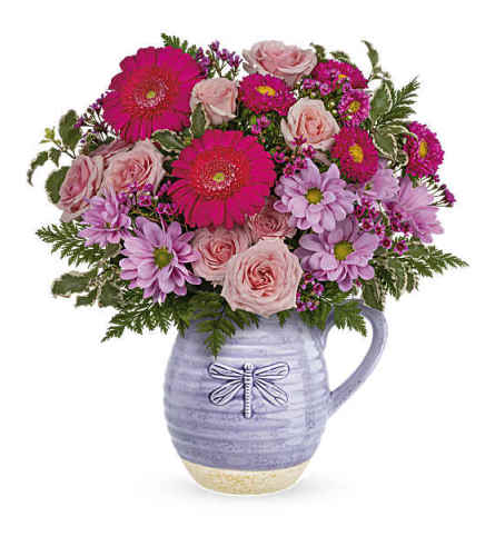 Teleflora's Pour on the Lavender. An arrangement by Love Floral.