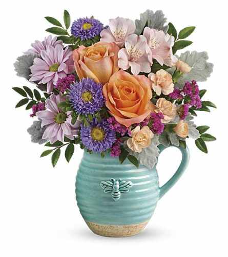 Teleflora's Busy Bee Pitcher. An arrangement by Love Floral.