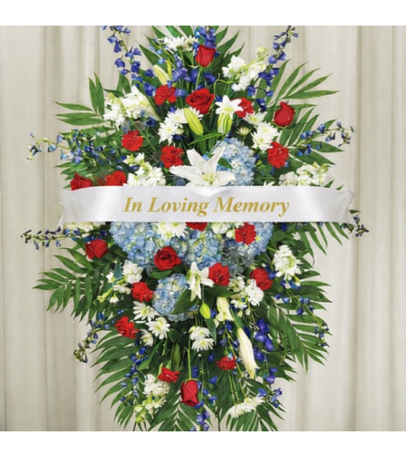 Patriotic Spray - Deluxe. An arrangement by Geni's Florist and Gifts.
