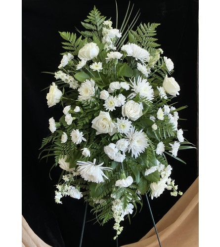 Resting Peacefully Spray. An arrangement by Roma Flowers and Gifts.