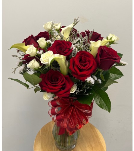 Lovely Reds with Calla Lily. An arrangement by Spring Garden Flowers.