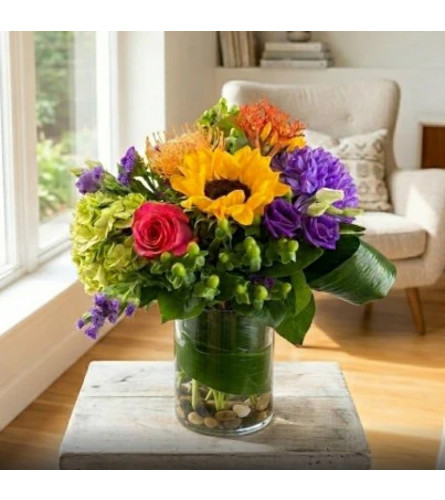 Vibrant mix in a vase. An arrangement by Sophie's Flowers.