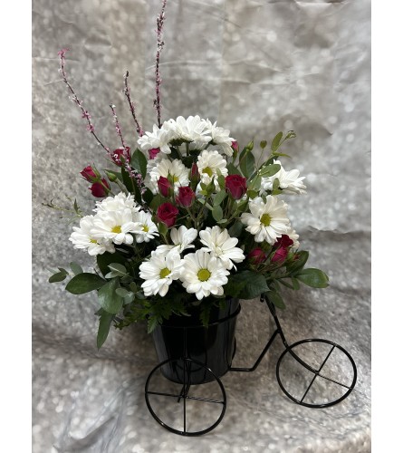 Charming Blossom Tricycle. An arrangement by Flowers by Neil.