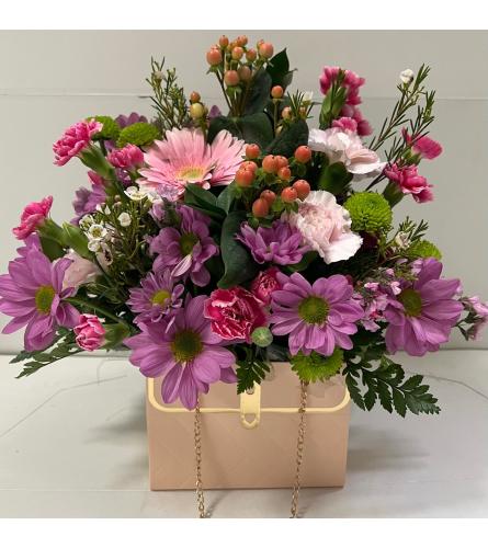 The Blooming Pink Chanel Purse - Deluxe. An arrangement by Shalimar Designs.