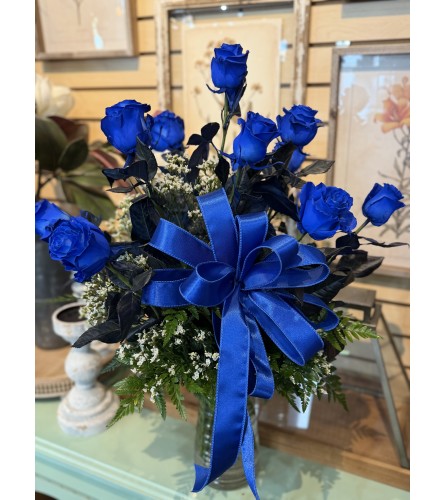 Dozen Blue Roses. An arrangement by Busse and Rieck Flowers Plants and Gifts.
