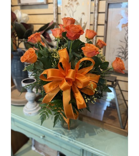 Dozen Orange Roses. An arrangement by Busse and Rieck Flowers Plants and Gifts.