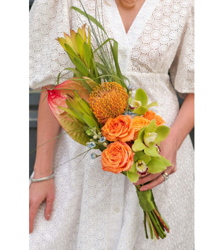 Bridal bouquet with a tropical vibe. An arrangement by Flowers and Beyond.
