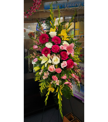 Pink and Yellow Spray. An arrangement by Sun Valley Florist.