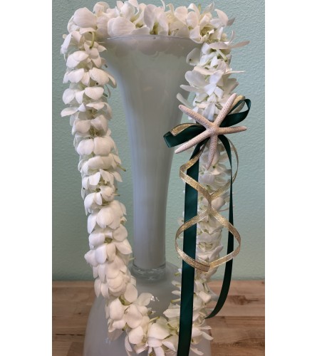 Graduation Lei - White Double Orchid. An arrangement by Shell Beach Floral Design.