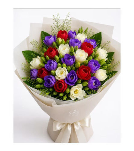 Sally's Spring - Freesia bouquet. An arrangement by Tim's Florist and Garden.